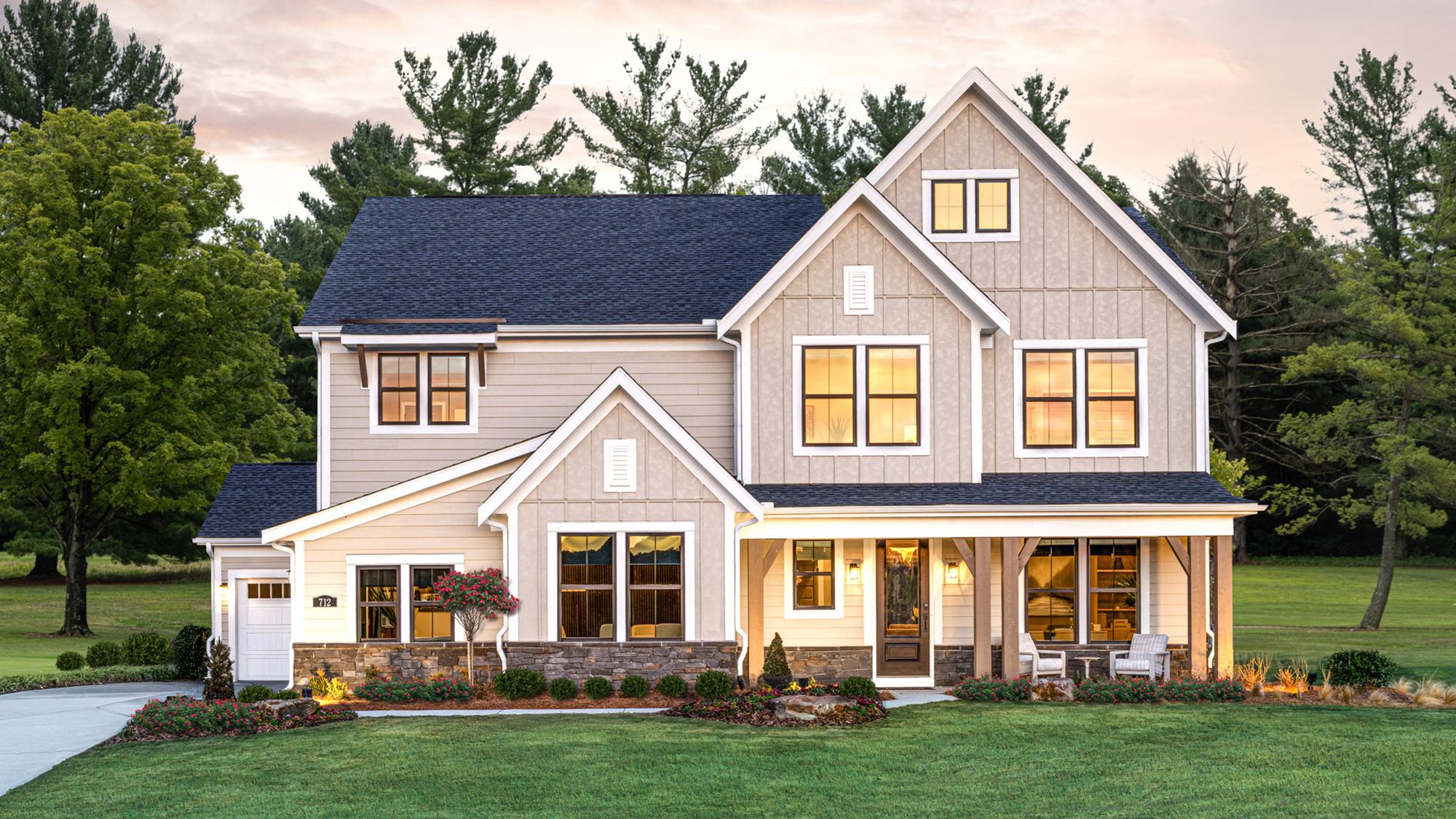 Freshly finished modern farmhouse exterior at dusk (stock photo)